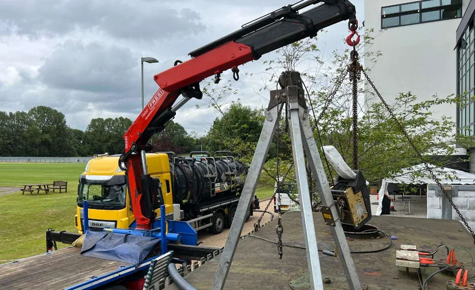 cran holding tank in mid air during removal